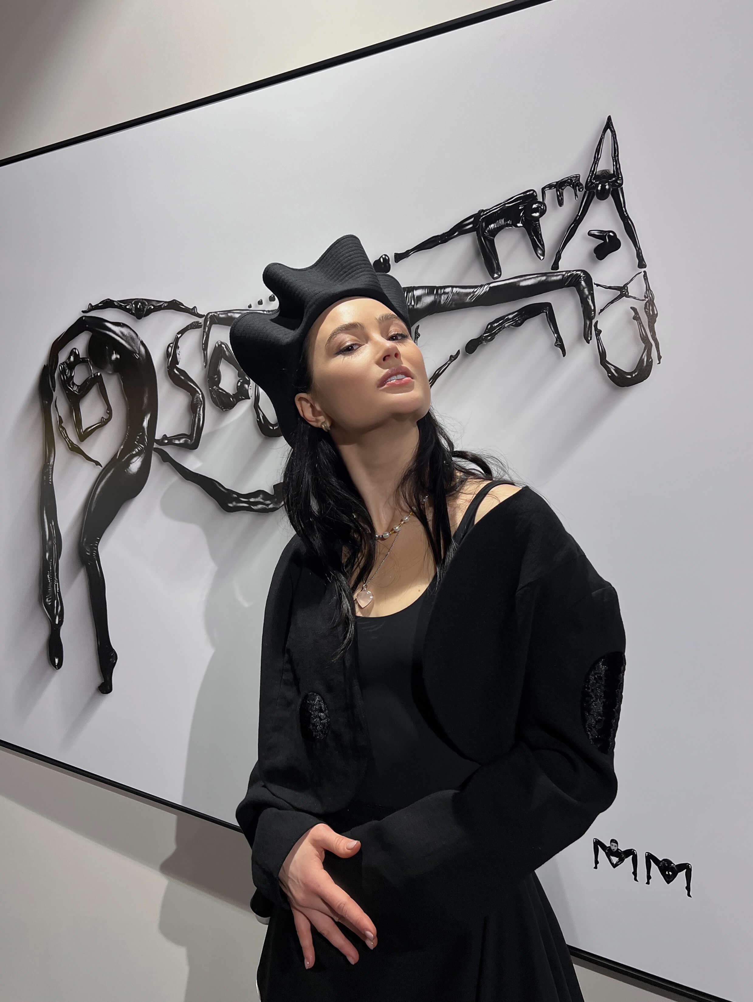 Marina Mazepa in front of a horse artwork