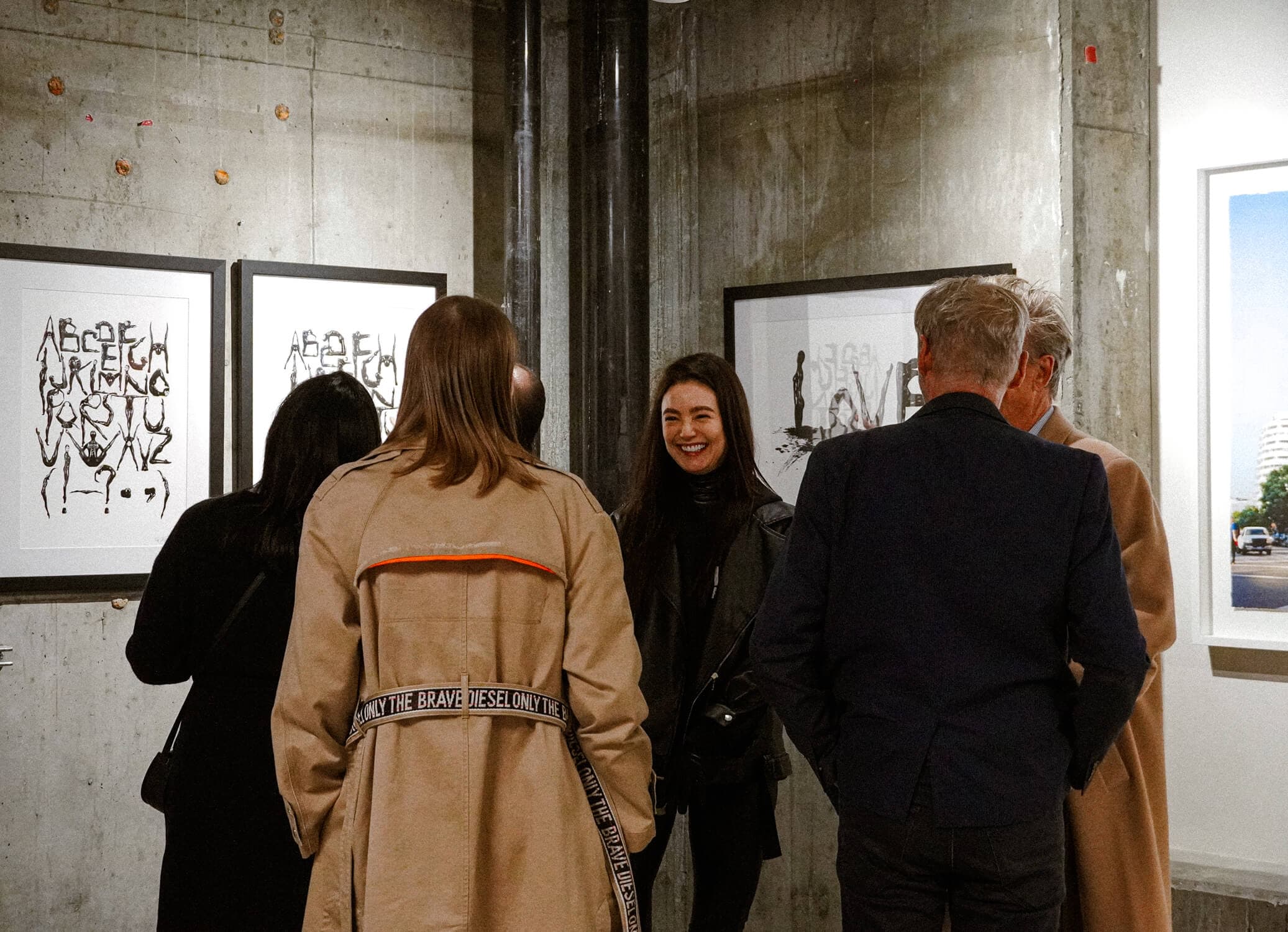 Visitors with Marina Mazepa at an exhibition